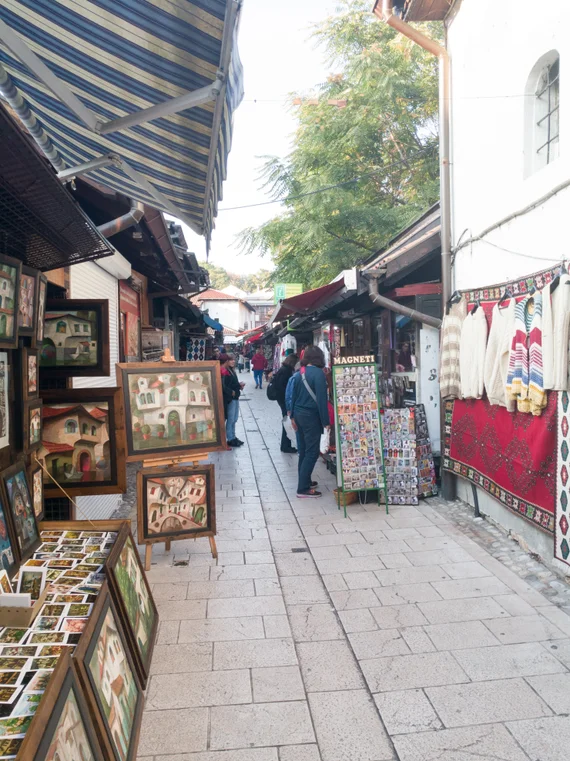 Narrow lane in the old bazaar lined with paintings, carpets, and souvenirs