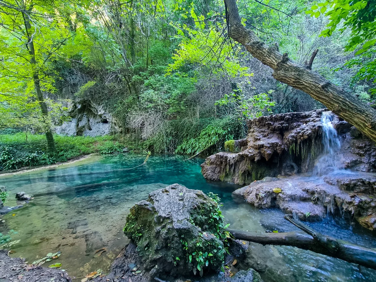 Turquoise pool beneath the Krushuna Waterfalls