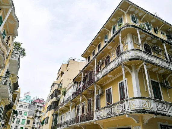 Portuguese colonial buildings with colorful balconies in old Macau