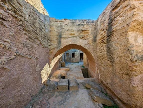 Stone archway inside an underground tomb passage