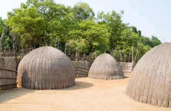 Traditional beehive huts made of woven grass at the Swazi cultural village