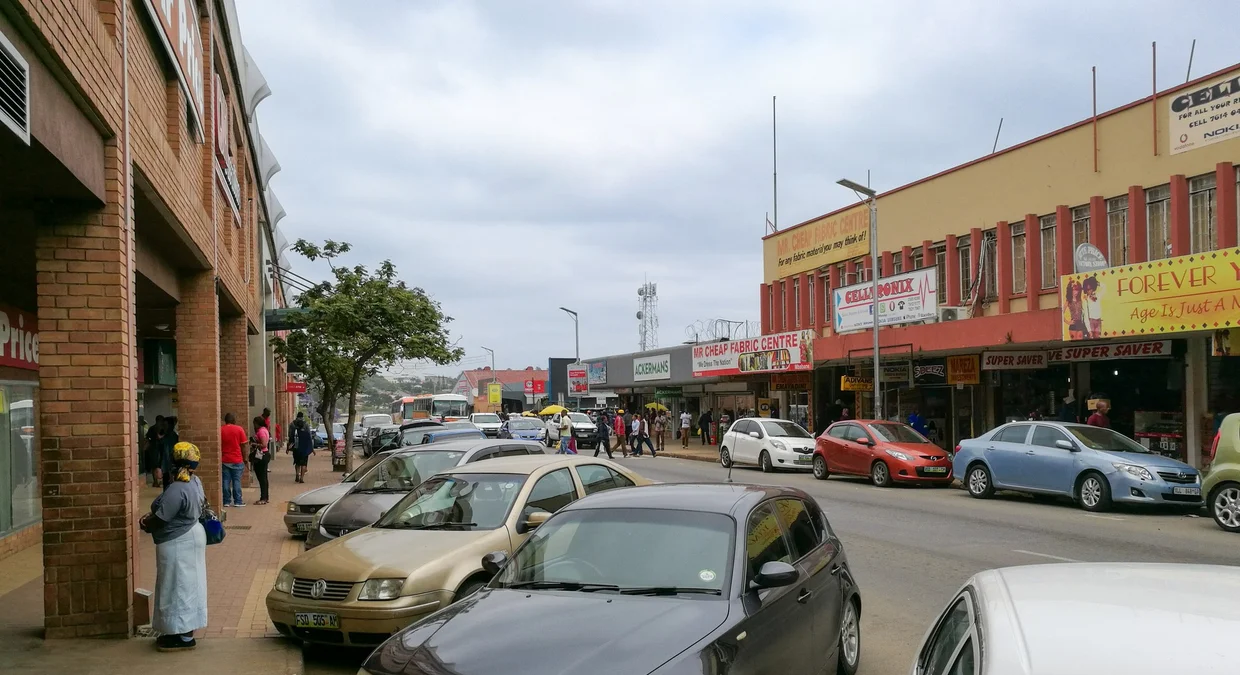 Mbabane main street with parked cars and small shops