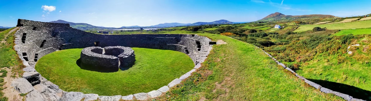 Panoramic view of the ring fort with green countryside and sea beyond