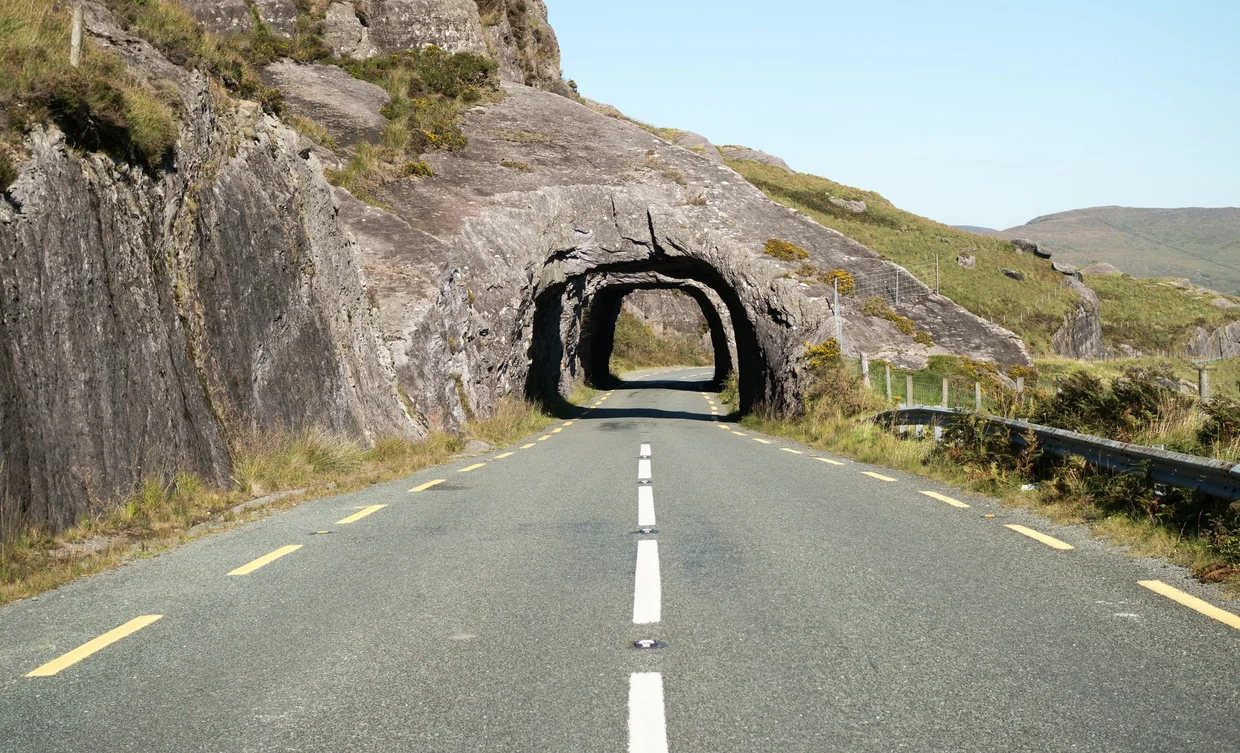 Road tunnel carved straight through the rock on the Ring of Kerry