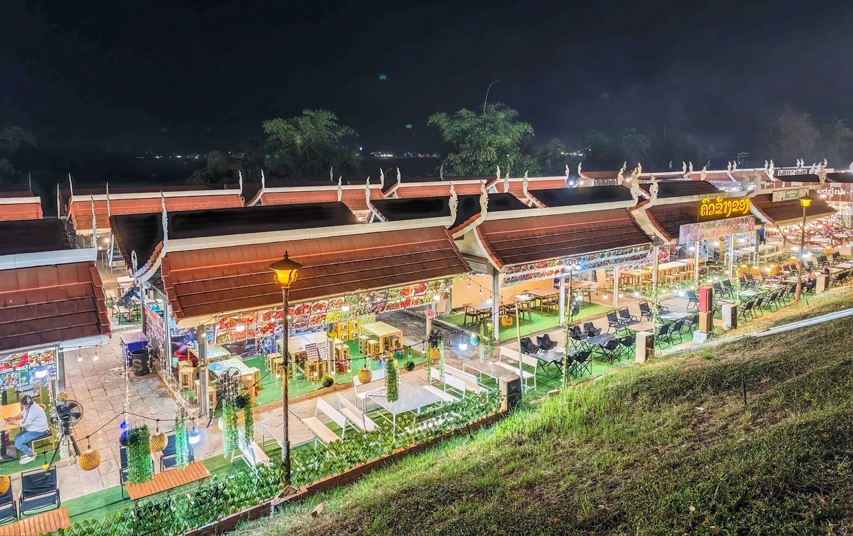 Riverside restaurants lit up at night