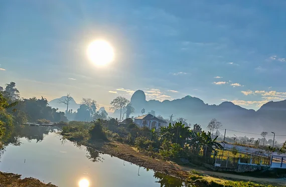 Misty sunrise over the karst mountains