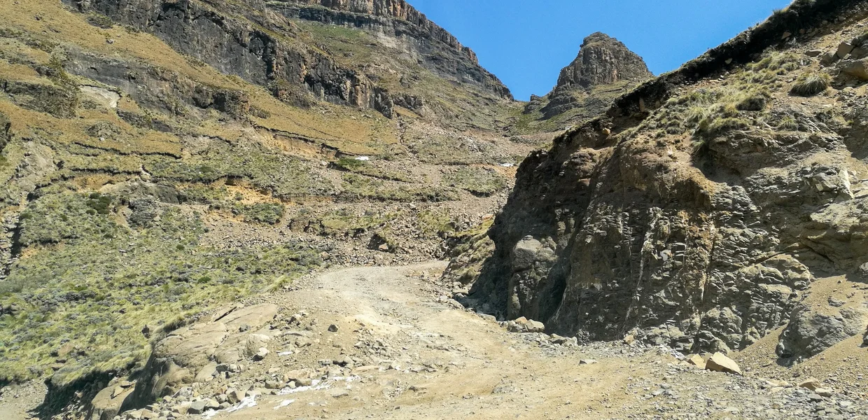 Rocky mountain road through a narrow pass