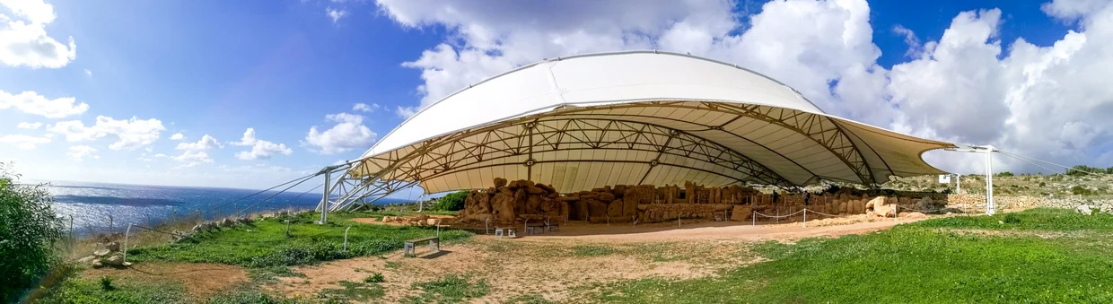 Hagar Qim temple complex under its protective canopy on the coastal cliff