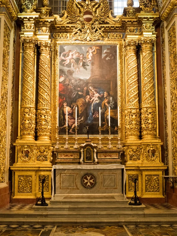 Another chapel with elaborate golden carvings and Maltese cross