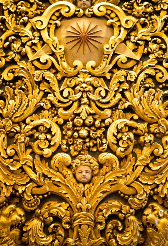 Close-up of gilded Baroque carving with Maltese cross star