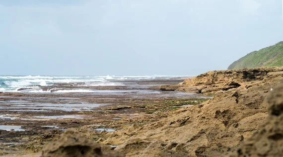 Rocky coastline with waves at Cape Vidal in iSimangaliso
