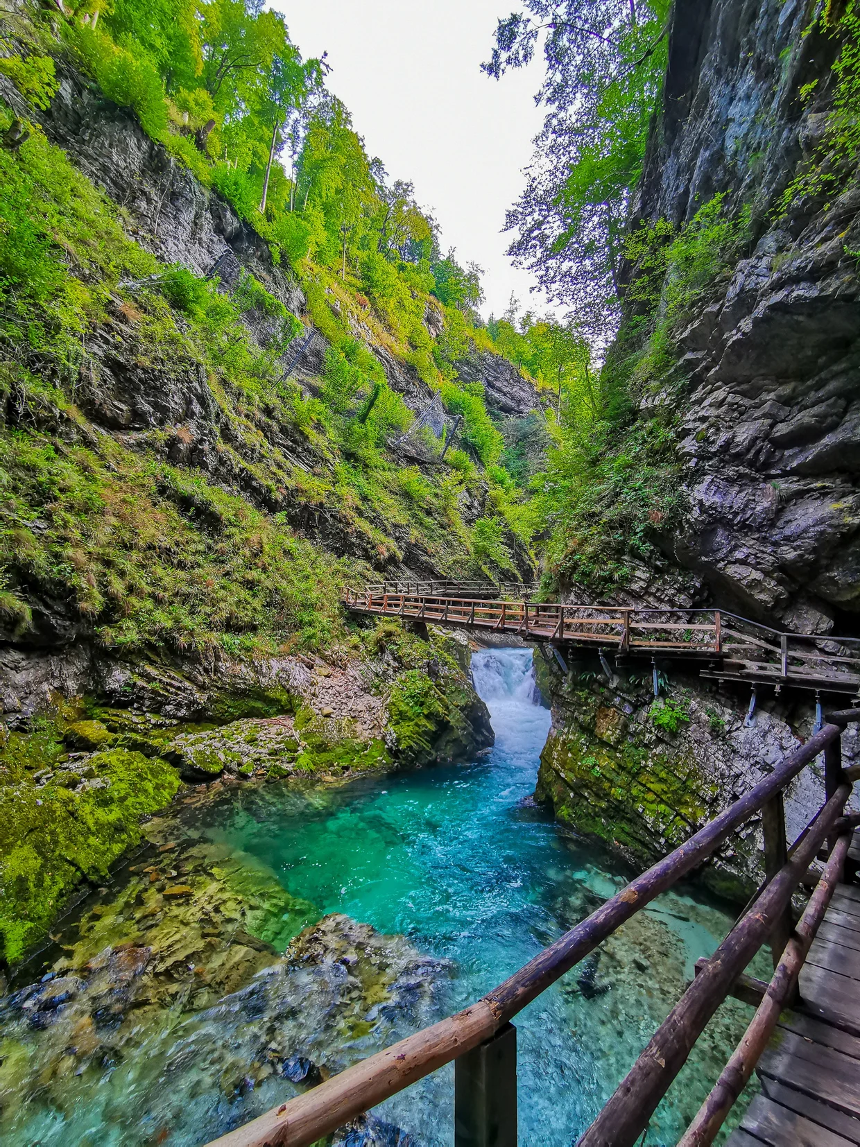 Gorge boardwalk crossing above vivid turquoise water