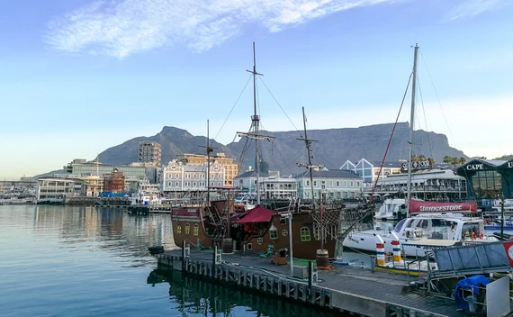 Replica sailing ship moored at the V&A Waterfront with Table Mountain behind
