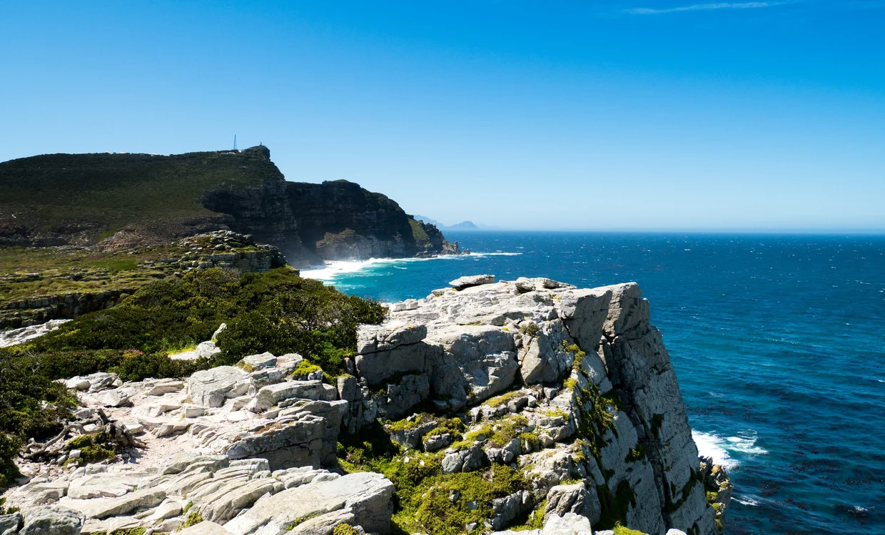Rocky cliffs at the Cape of Good Hope with waves crashing below