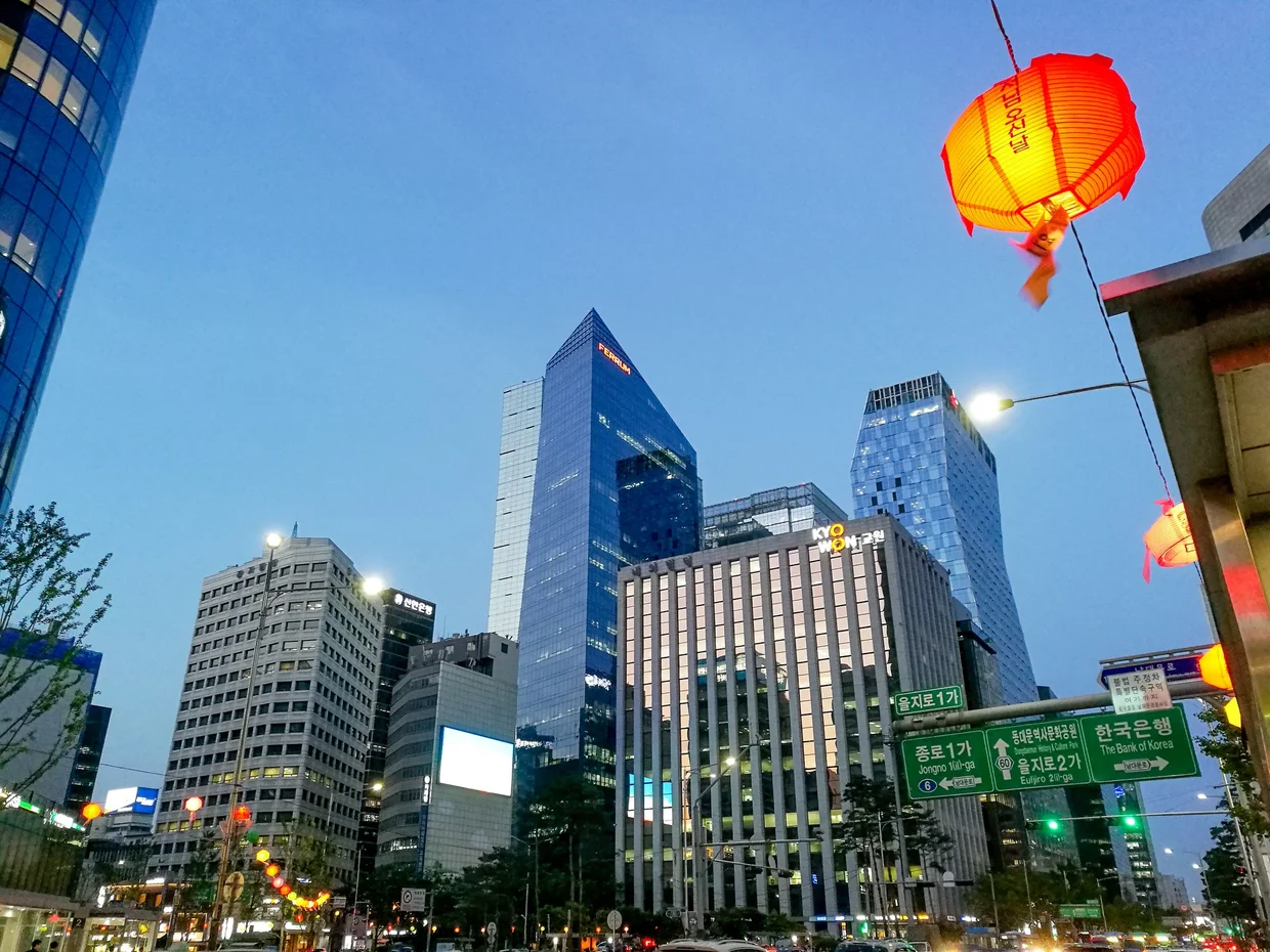 Downtown Seoul at dusk, skyscrapers and a red lantern in the Jongno district