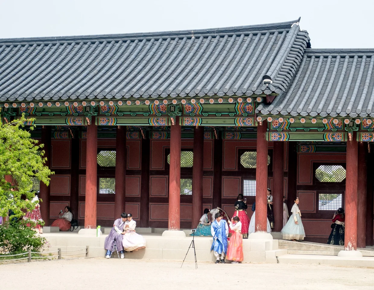 Ornate palace building with green and red paintwork and traditional roof