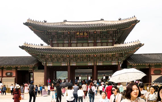 Gyeongbokgung main gate with crowds of visitors