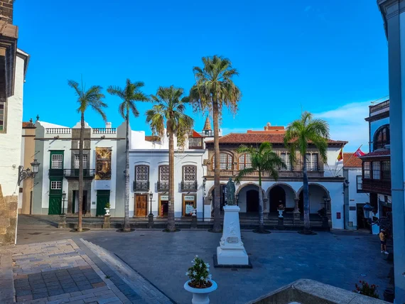 Plaza de España with colonial buildings and palm trees