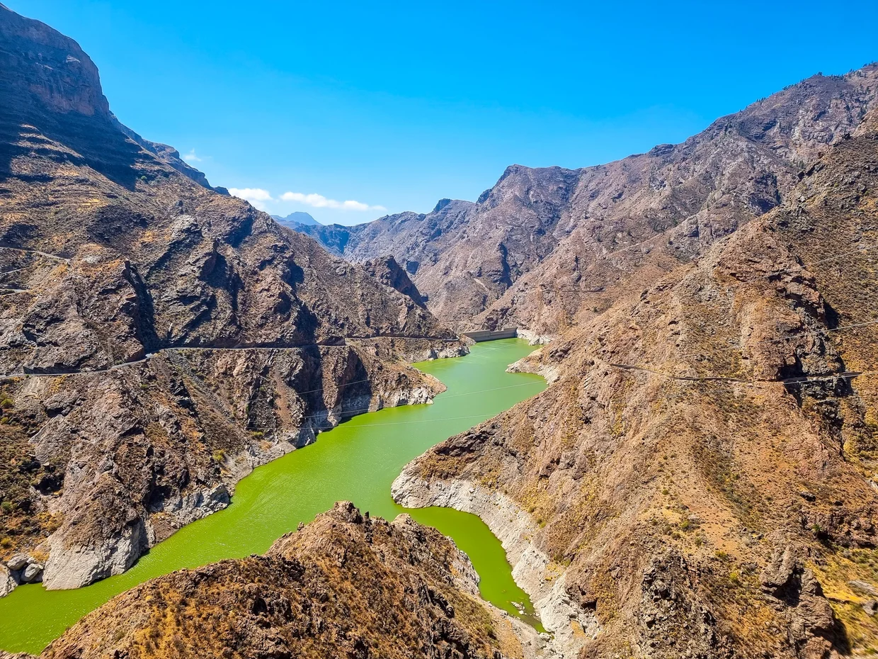 Dramatic canyon and emerald reservoir in Gran Canaria