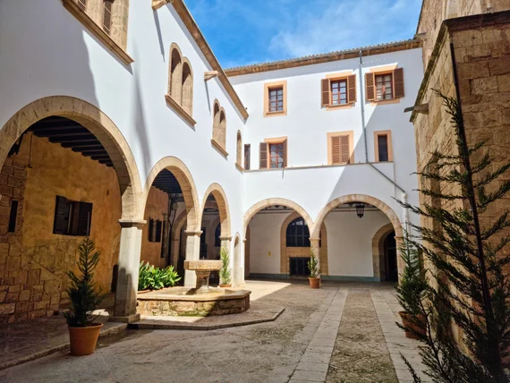 Medieval courtyard with stone arches in the old town