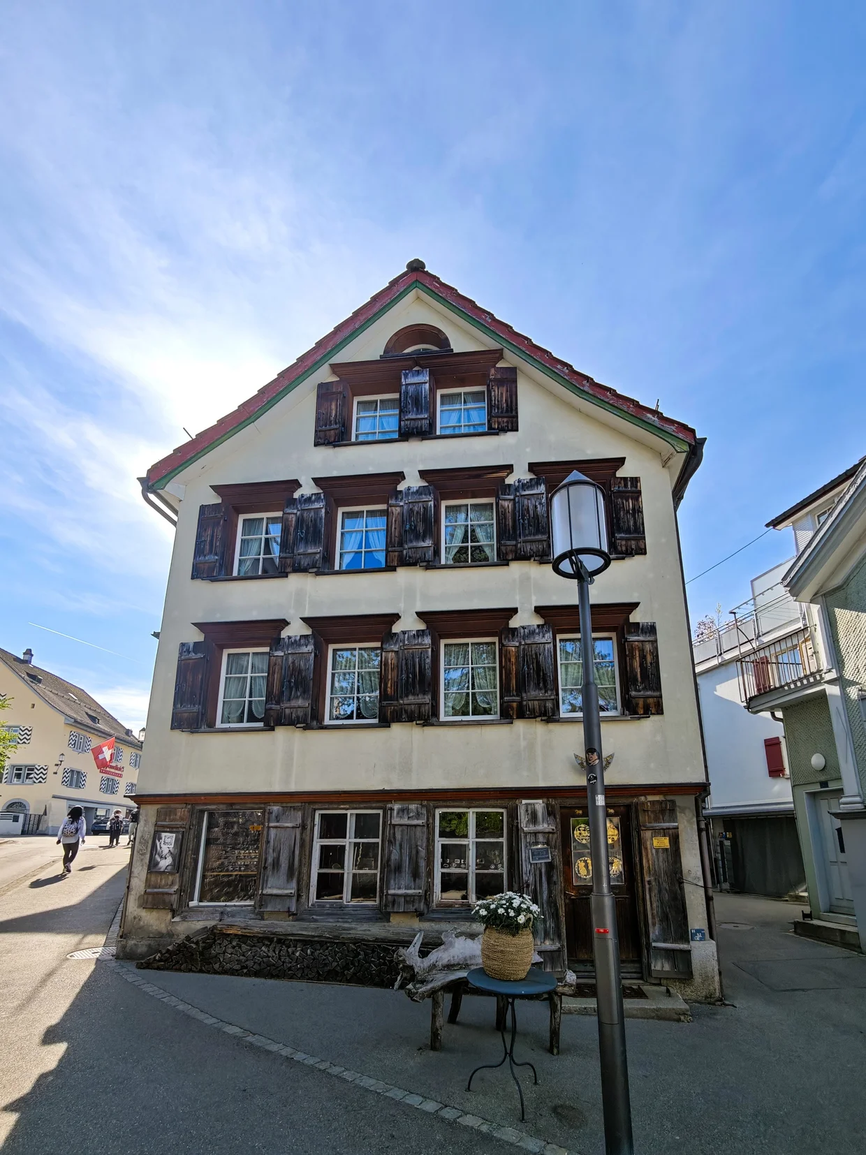An older wooden-shuttered traditional Appenzeller house on a side street