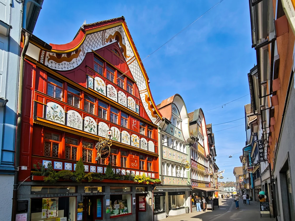 Famous orange and red painted facade of the Adler restaurant building