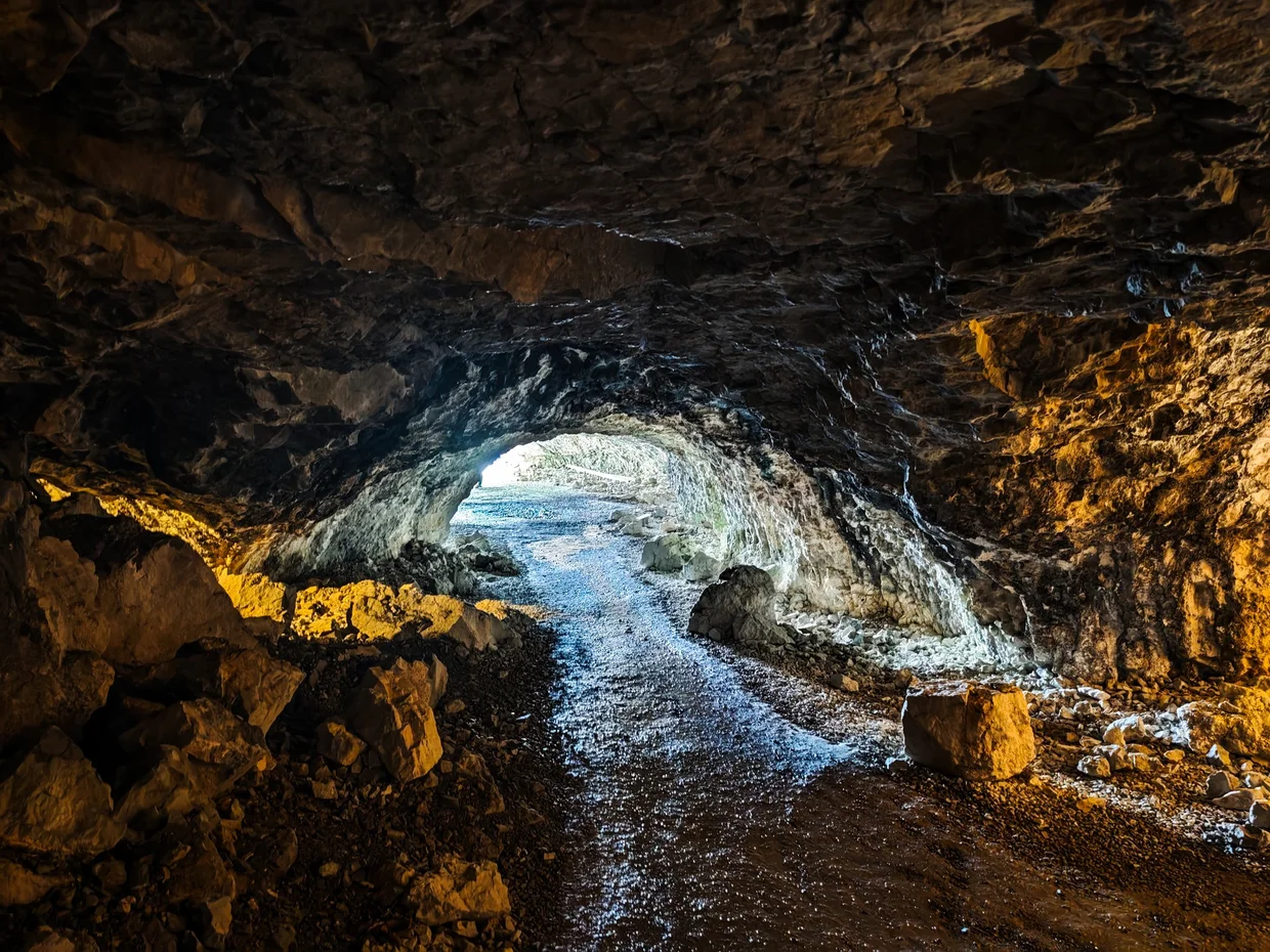 Inside the Wildkirchli cave looking out toward the daylight at the far end