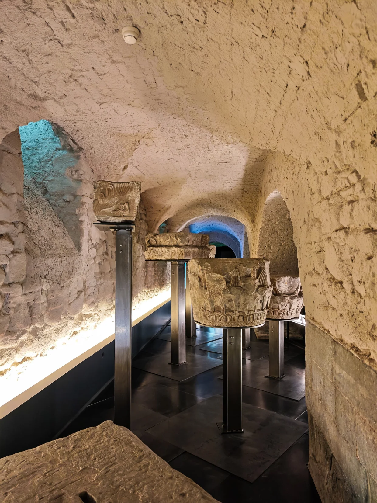 The whitewashed crypt with old carved stone columns