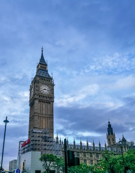 Big Ben and the Elizabeth Tower rising into a moody blue sky