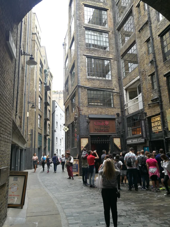 Narrow cobblestone alley near Borough Market, old brick warehouse buildings