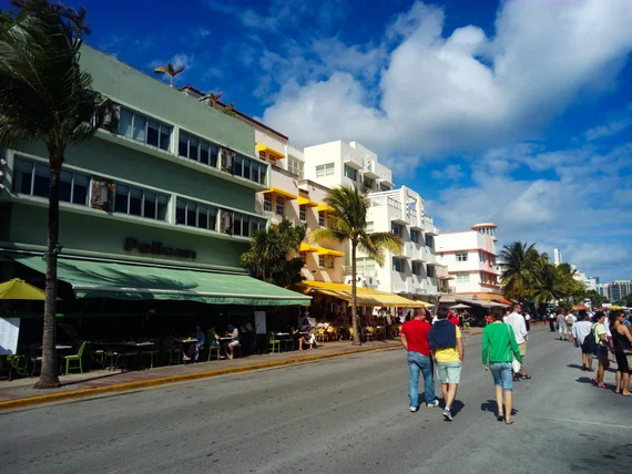 Pastel facades and sidewalk cafes