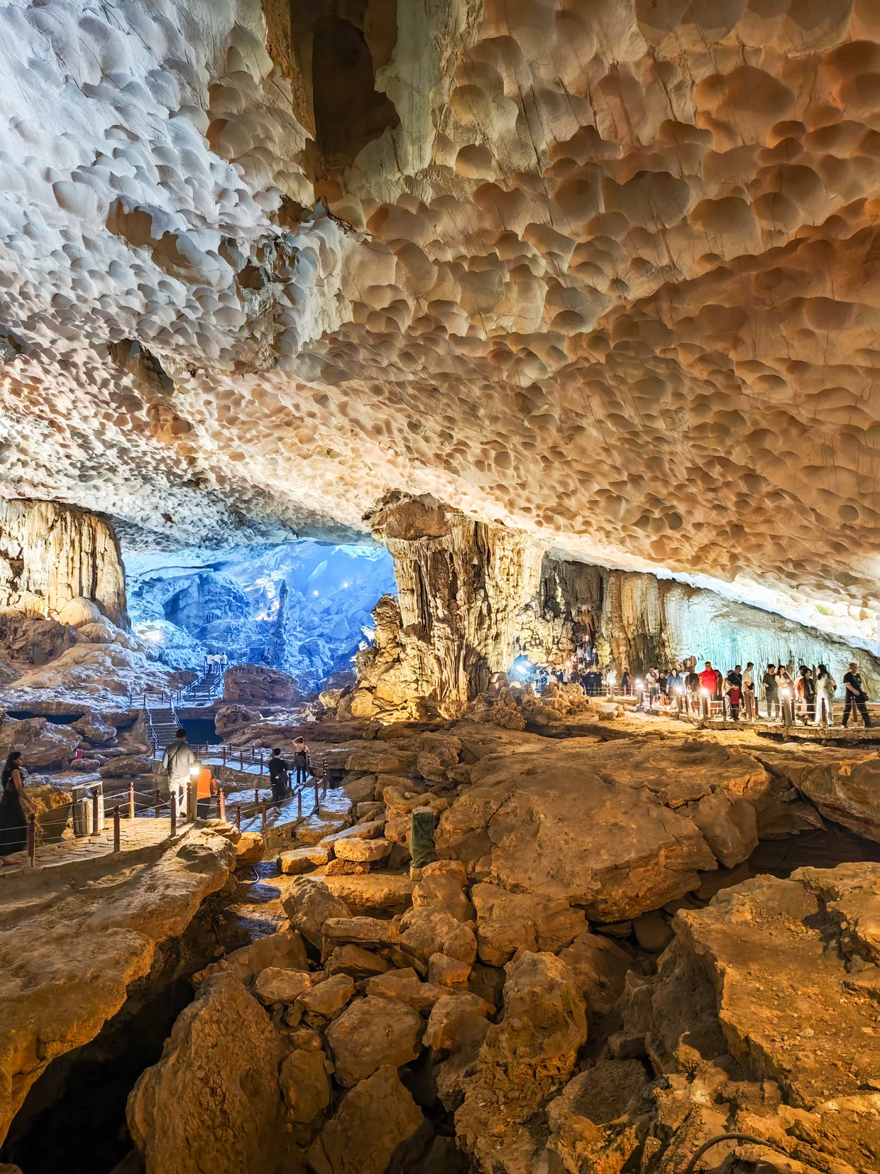 Interior of Sung Sot Cave with illuminated rock formations