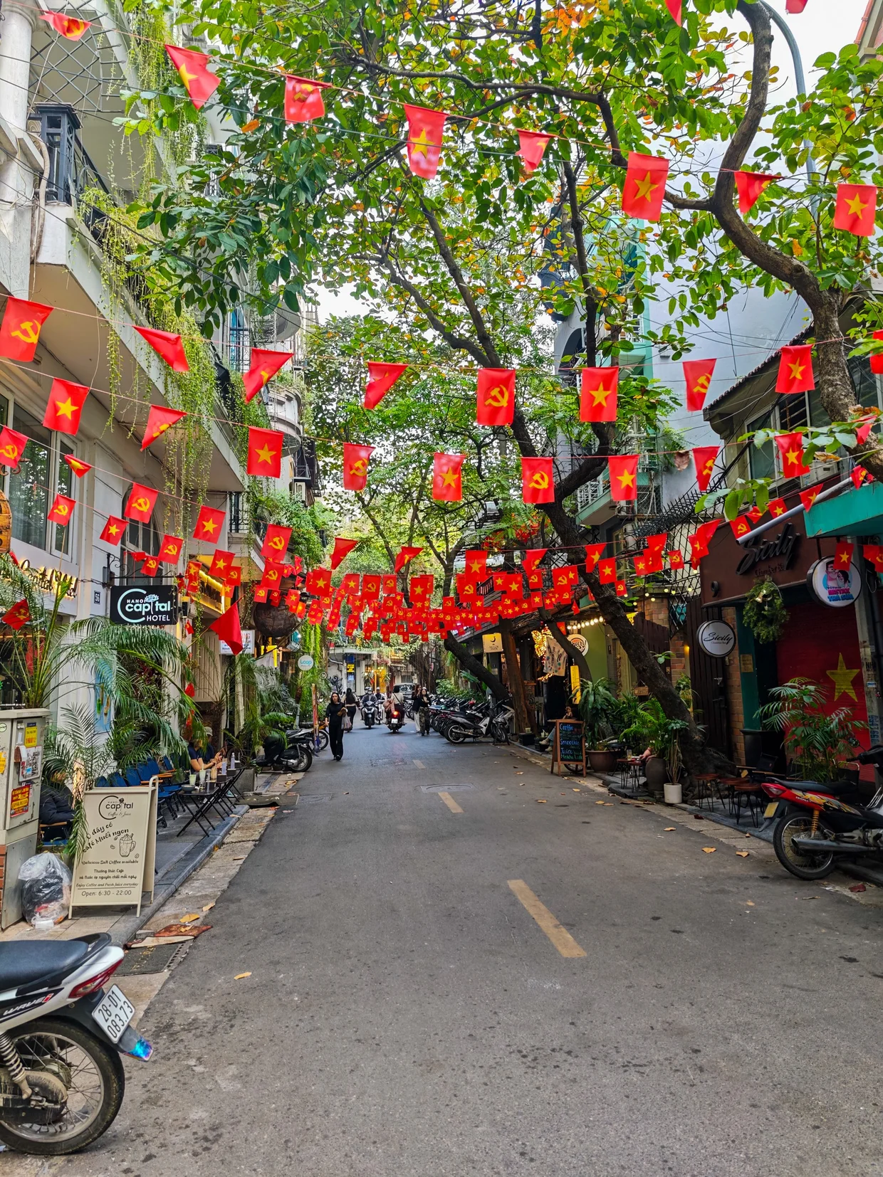 A street in Hanoi's Old Quarter draped in red flags