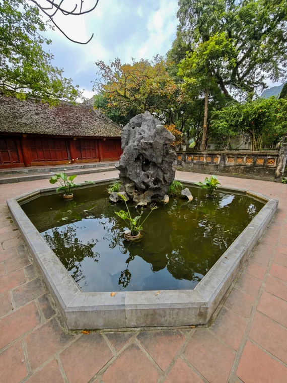 Stone rock feature in a small pond courtyard at Hoa Lu